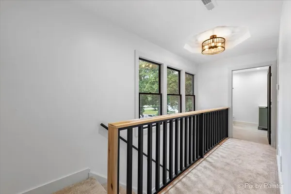 a view of hallway with a window