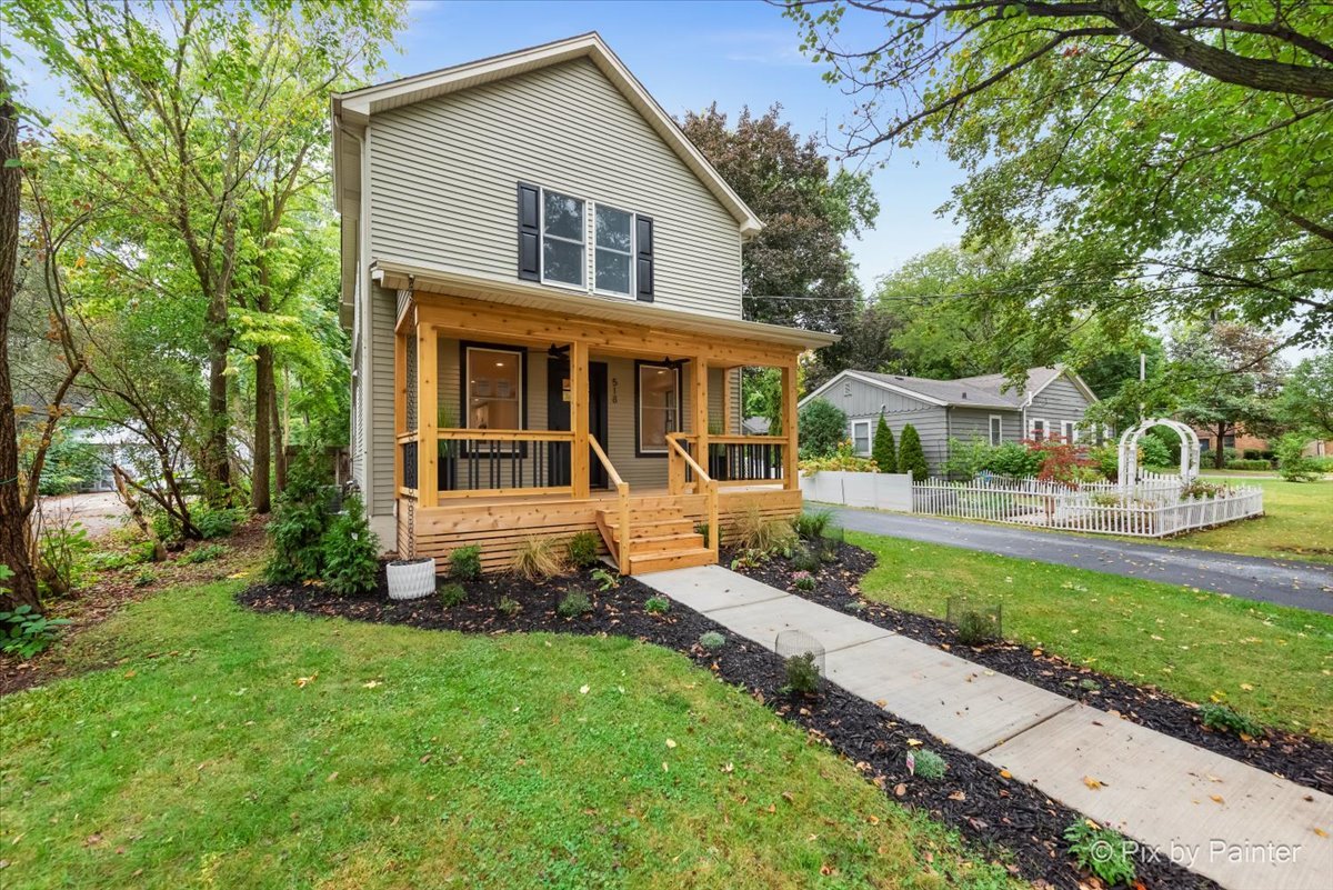 518 Illinois Street Geneva, IL 60134 - Photo 2 of 41 a front view of a house with a yard