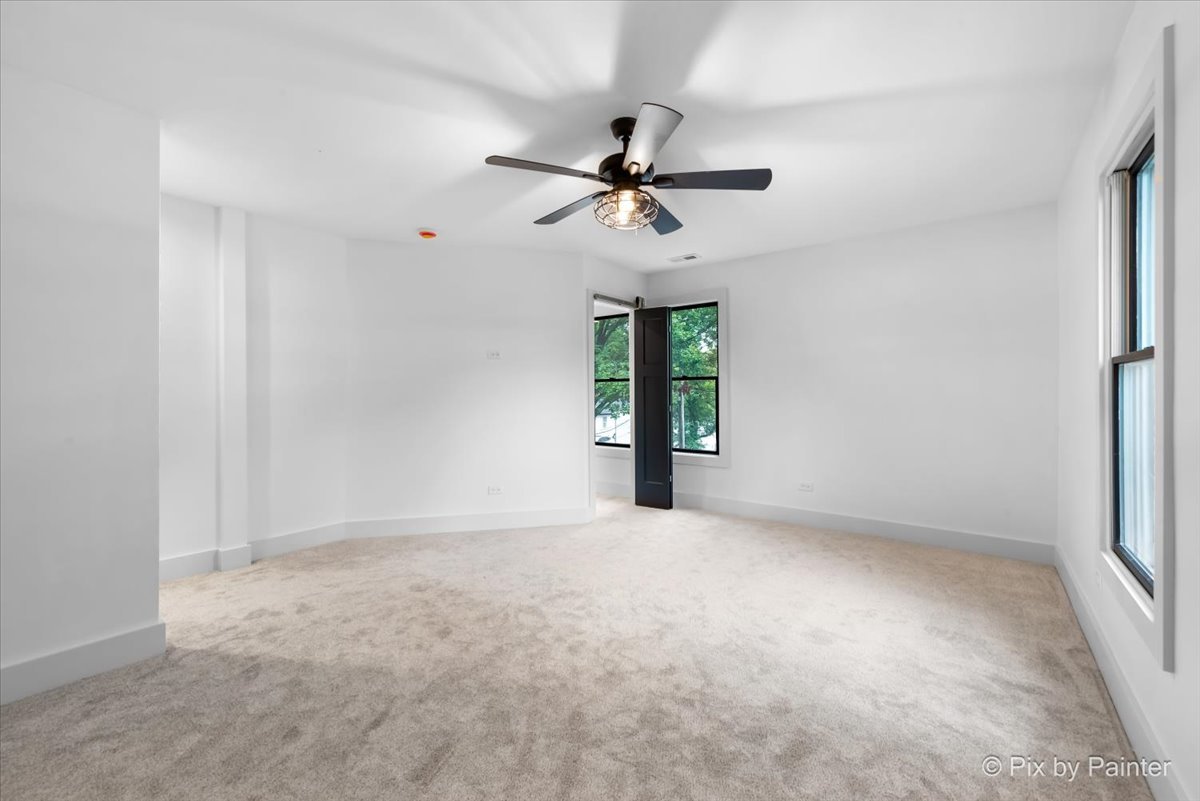 518 Illinois Street Geneva, IL 60134 - Photo 21 of 41 a view of an empty room with a window