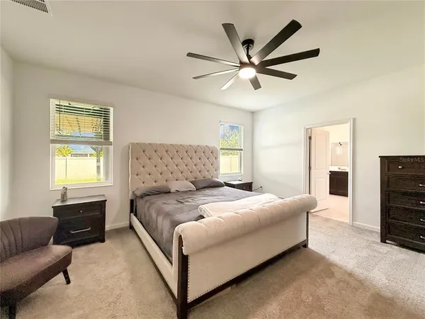 a bathroom with a painting on the wall and a shower