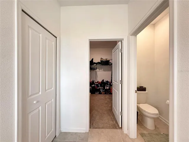 a bathroom with a bathtub and a shower curtain
