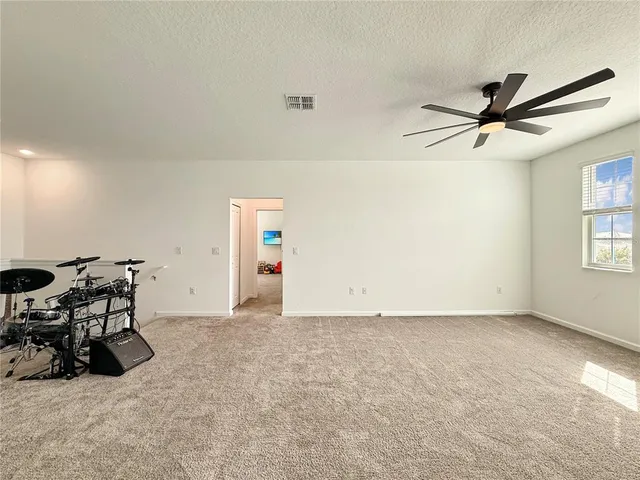 a view of a porch with a table and chairs