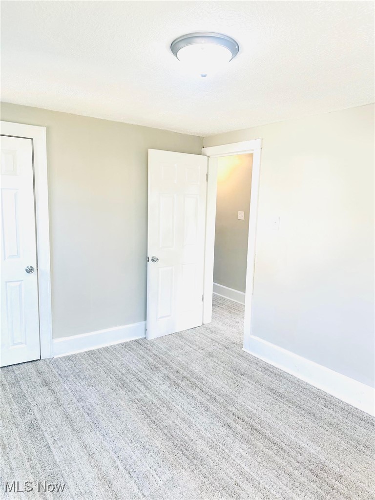 1389 Diagonal Road Akron, OH 44320 - Photo 20 of 20 Carpeted spare room with baseboards