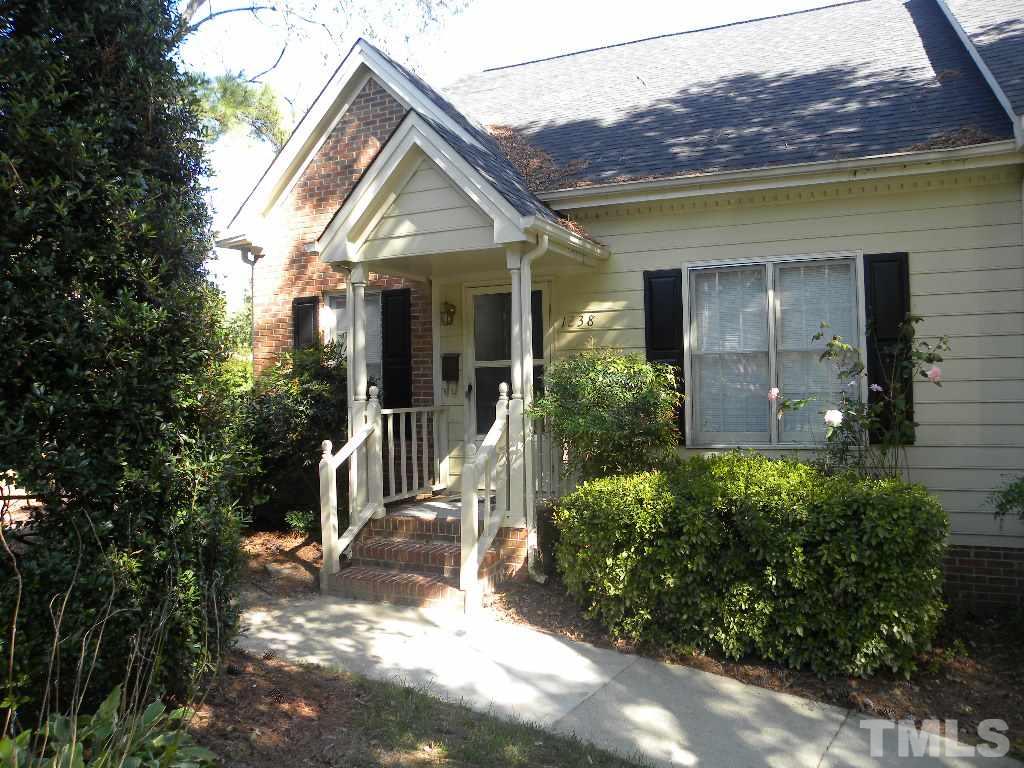 1238 Shadow Bark Court Raleigh, NC 27603 - Photo 1 of 17 a view of a house with a small yard plants and large tree