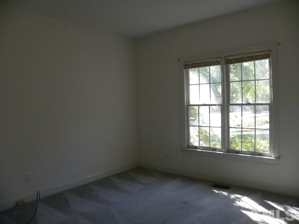 1238 Shadow Bark Court Raleigh, NC 27603 - Photo 11 of 17 an empty room with a window