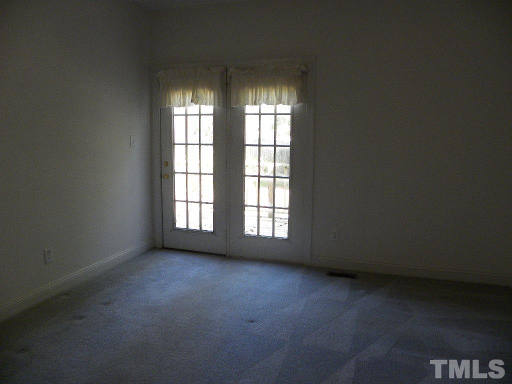 1238 Shadow Bark Court Raleigh, NC 27603 - Photo 9 of 17 an empty room with a window