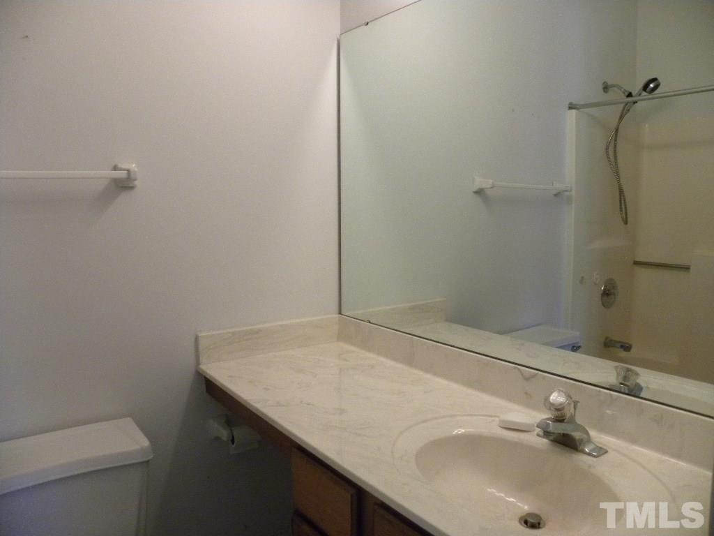 1238 Shadow Bark Court Raleigh, NC 27603 - Photo 10 of 17 a bathroom with a sink and a vanity