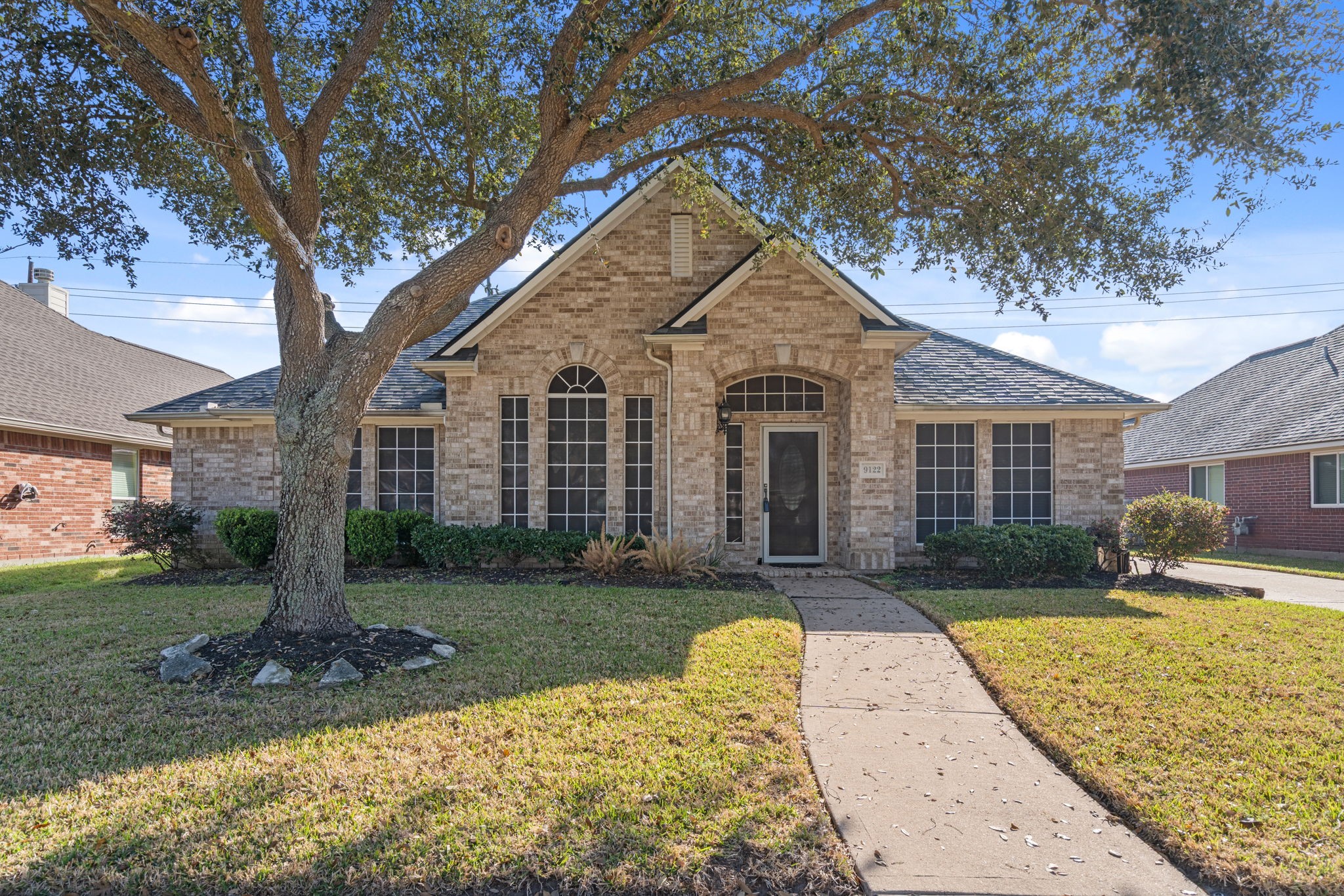 9122 Sunny Ridge Drive Houston, TX 77095 - Photo 1 of 15 a front view of a house with a yard