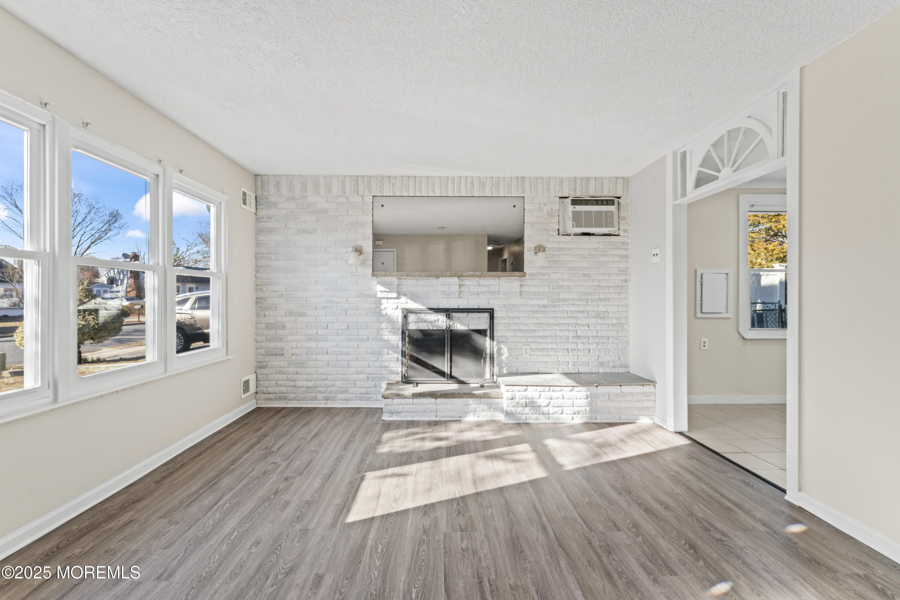 22 Anchor Road Barnegat, NJ 08005 - Photo 5 of 22 a view of a livingroom with wooden floor and a fireplace
