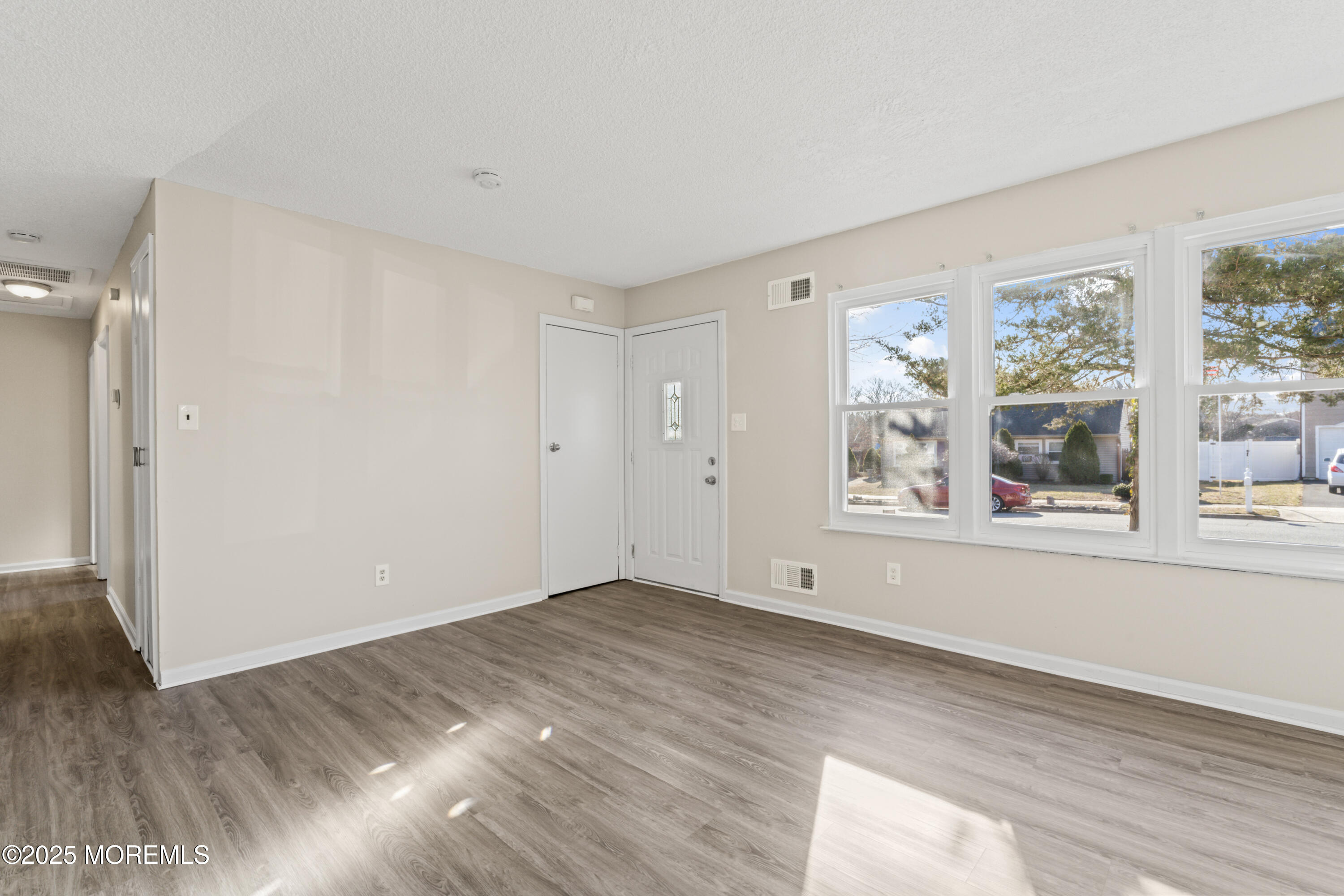 22 Anchor Road Barnegat, NJ 08005 - Photo 6 of 22 wooden floor in an empty room with a window