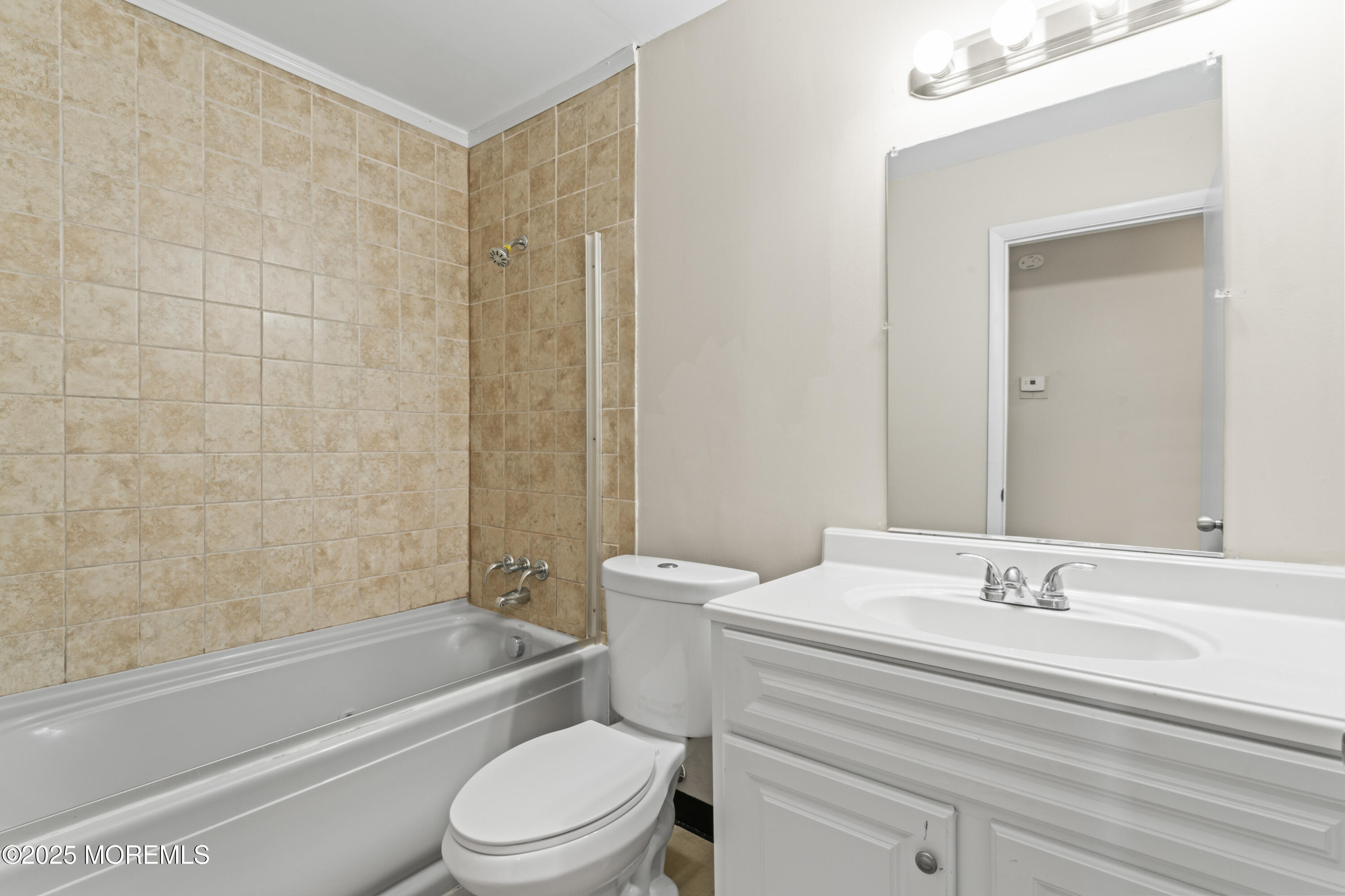 22 Anchor Road Barnegat, NJ 08005 - Photo 9 of 22 a bathroom with a granite countertop toilet a sink and a bathtub