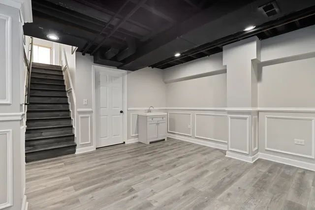 a lobby with furniture and a potted plant