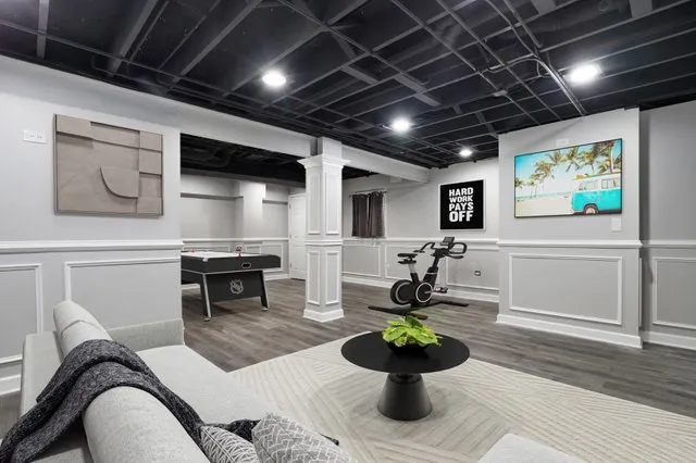 a view of an empty room with wooden floor