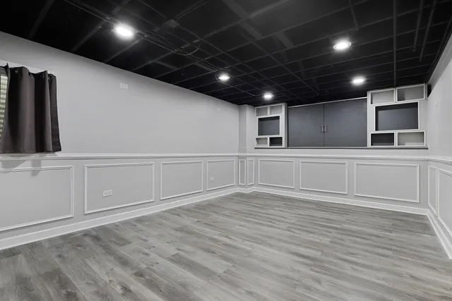 a view of deck with seating space and trees