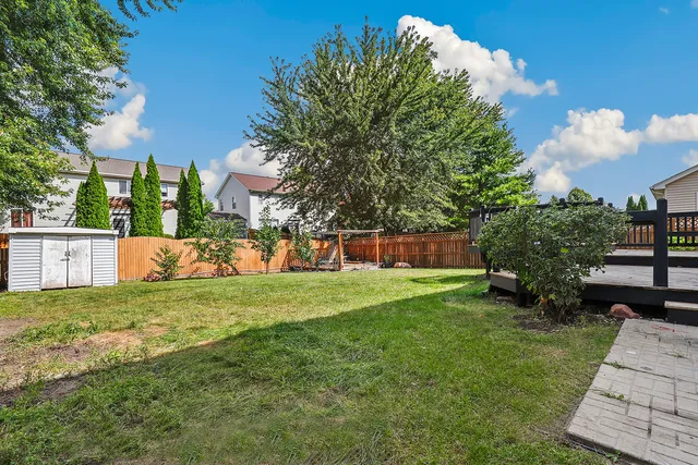 a view of a patio with a table and chairs