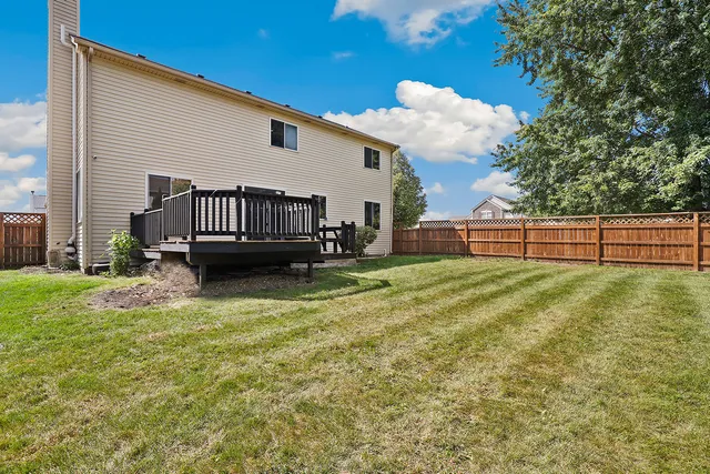 a view of outdoor space with sign board and garden