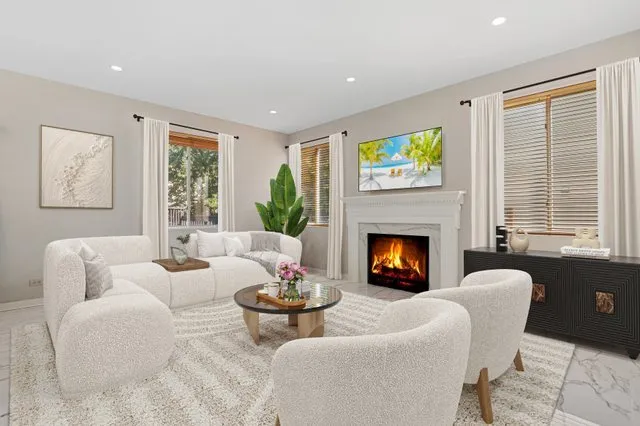 an empty room with a window and a fireplace