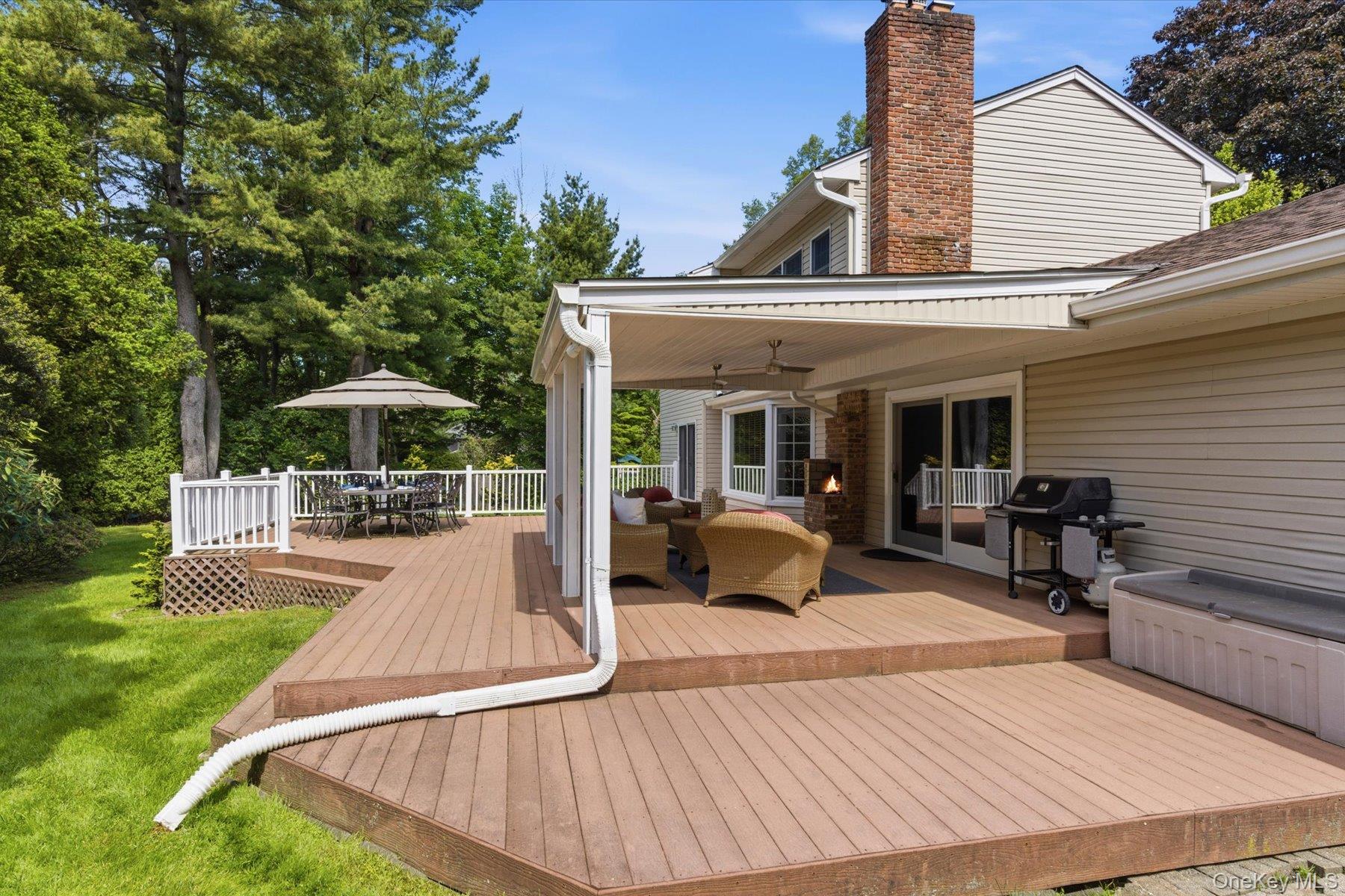 6 Brandy Road Cold Spring Harbor, NY 11724 - Photo 22 of 25 a view of a house with backyard porch and sitting area
