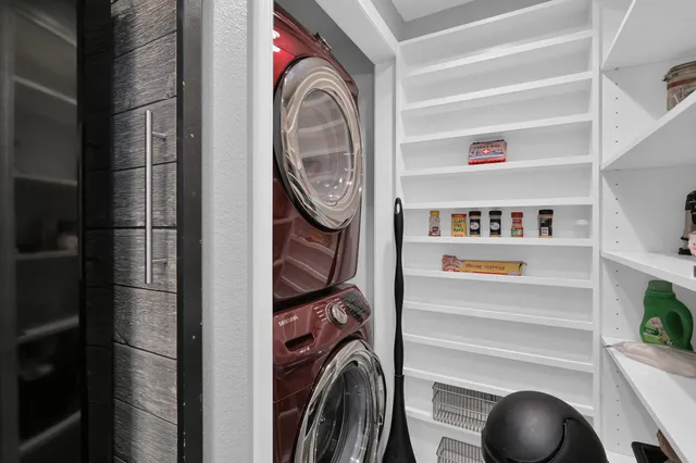 a kitchen with stainless steel appliances granite countertop a sink refrigerator and cabinets