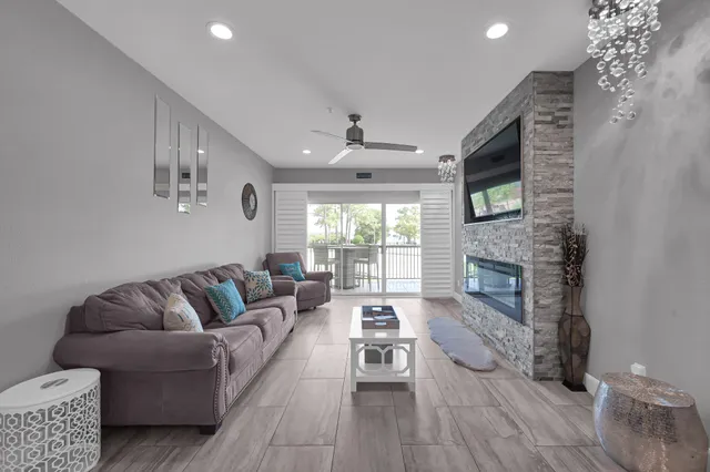 a living room with furniture and a large window