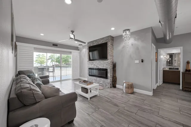 a living room with furniture and a fireplace