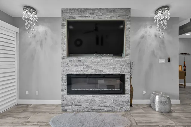 a living room with furniture fireplace and a flat screen tv