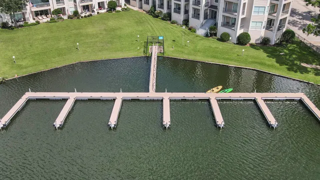 a view of a swimming pool with a yard