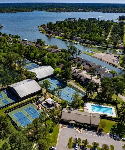 an aerial view of multiple houses with yard