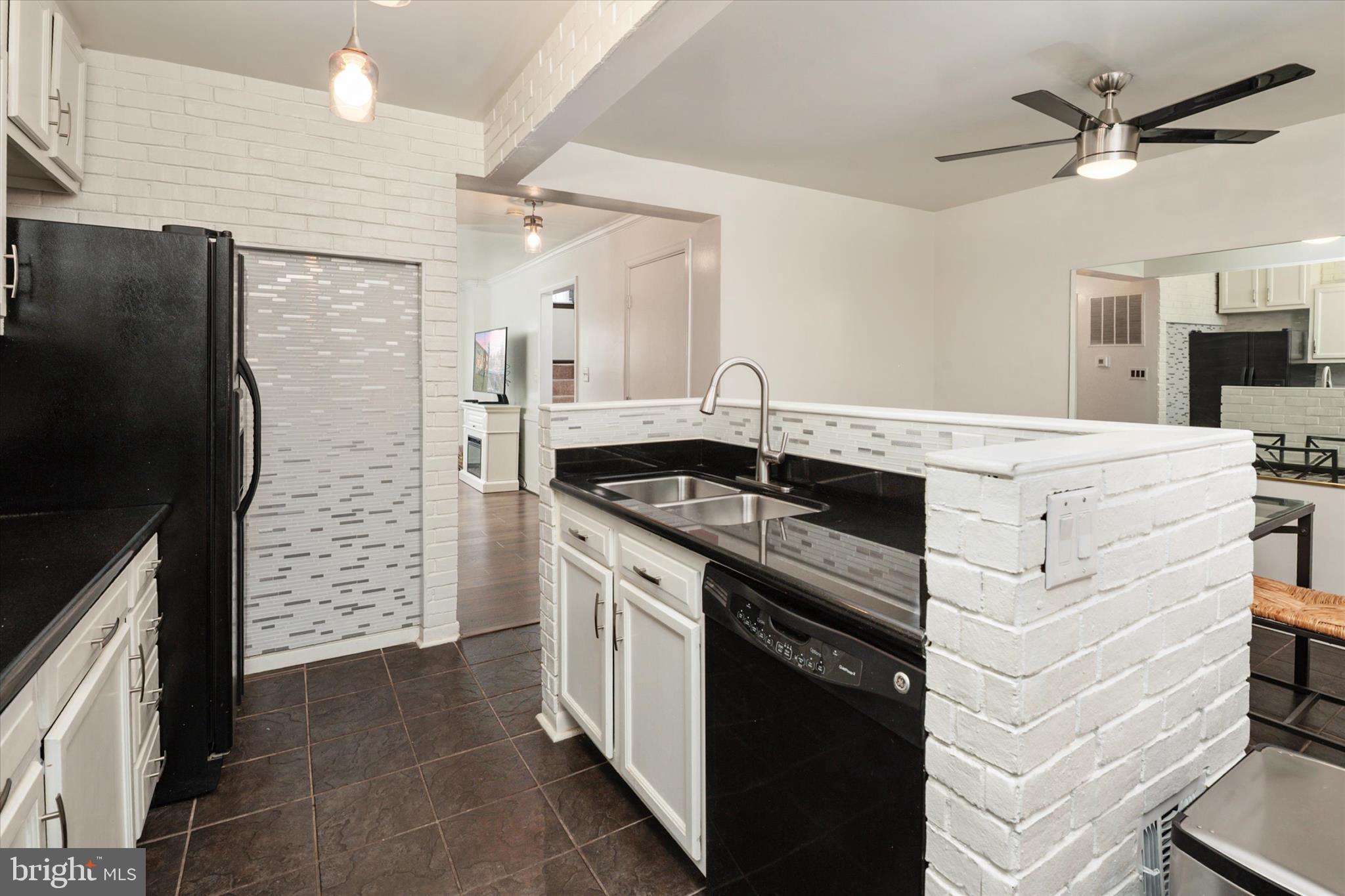 1353 Morris Road Southeast Washington, DC 20020 - Photo 12 of 32 a kitchen with a sink stove and refrigerator