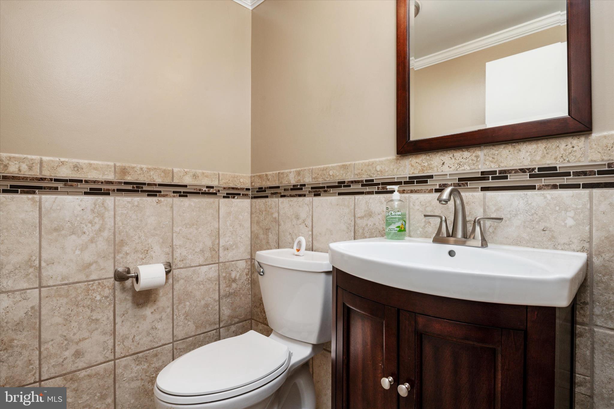 1353 Morris Road Southeast Washington, DC 20020 - Photo 13 of 32 a bathroom with a sink a toilet and mirror