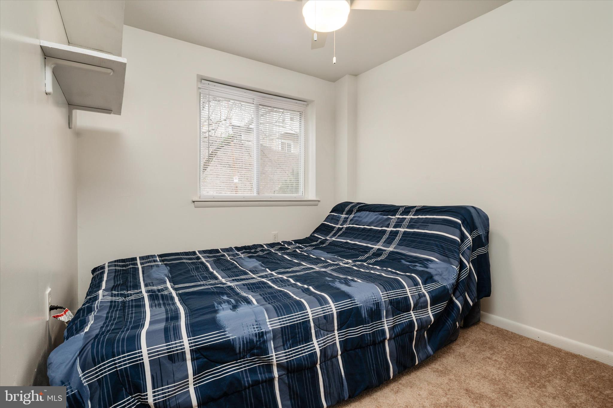 1353 Morris Road Southeast Washington, DC 20020 - Photo 20 of 32 a bedroom with a bed and window