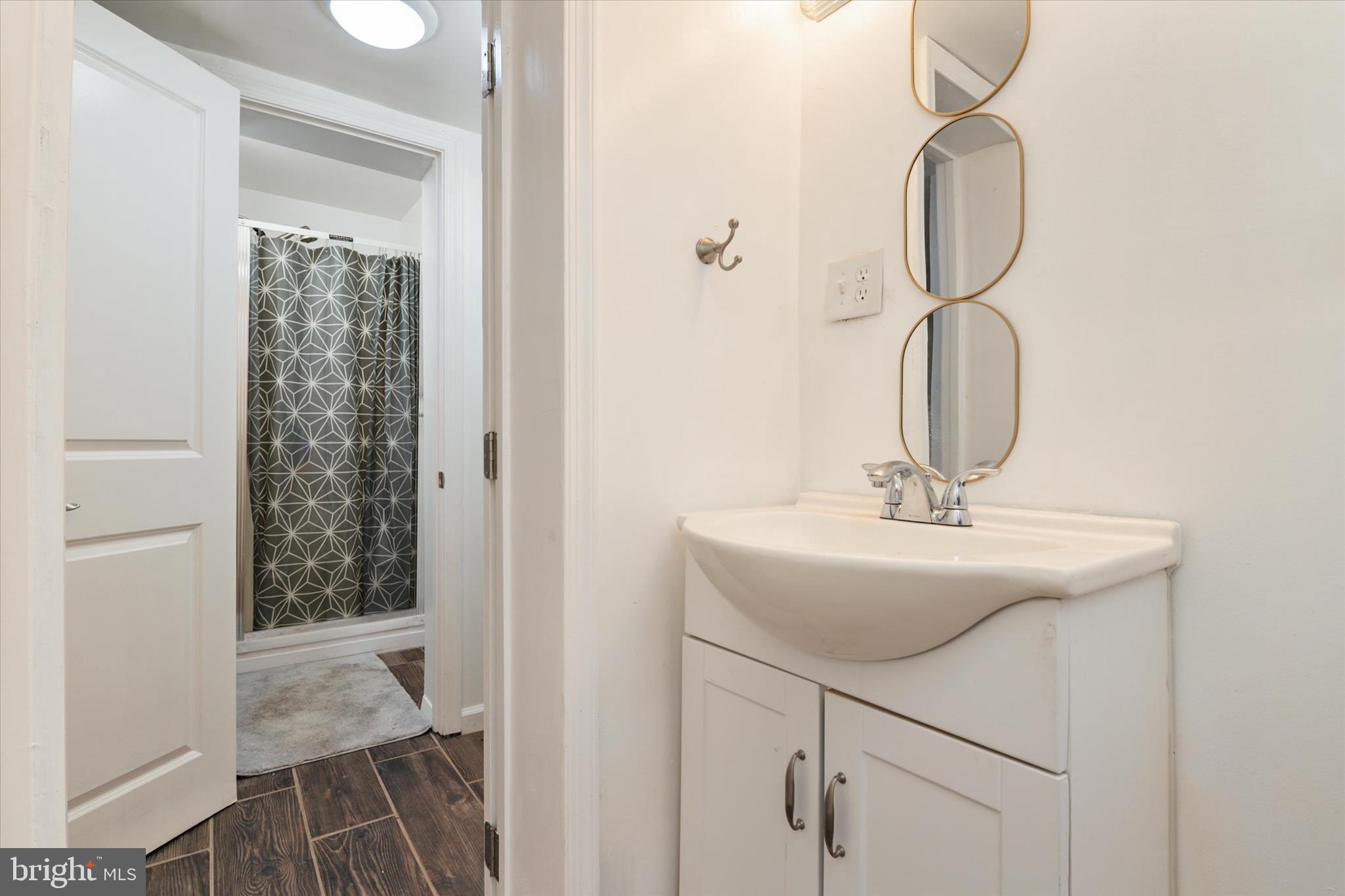 1353 Morris Road Southeast Washington, DC 20020 - Photo 24 of 32 a bathroom with a sink and a mirror