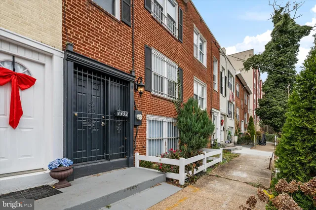 a view of a brick building with many windows