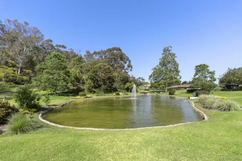 a view of a lake with a yard