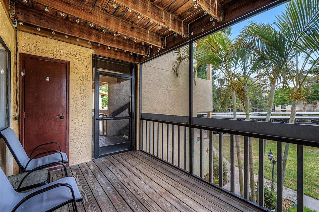 1550 South Belcher Road, Unit 525 Clearwater, FL 33764 - Photo 4 of 28 a view of a balcony with furniture and a potted plant