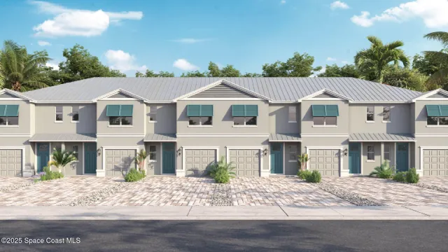 a front view of a residential houses with yard and green space