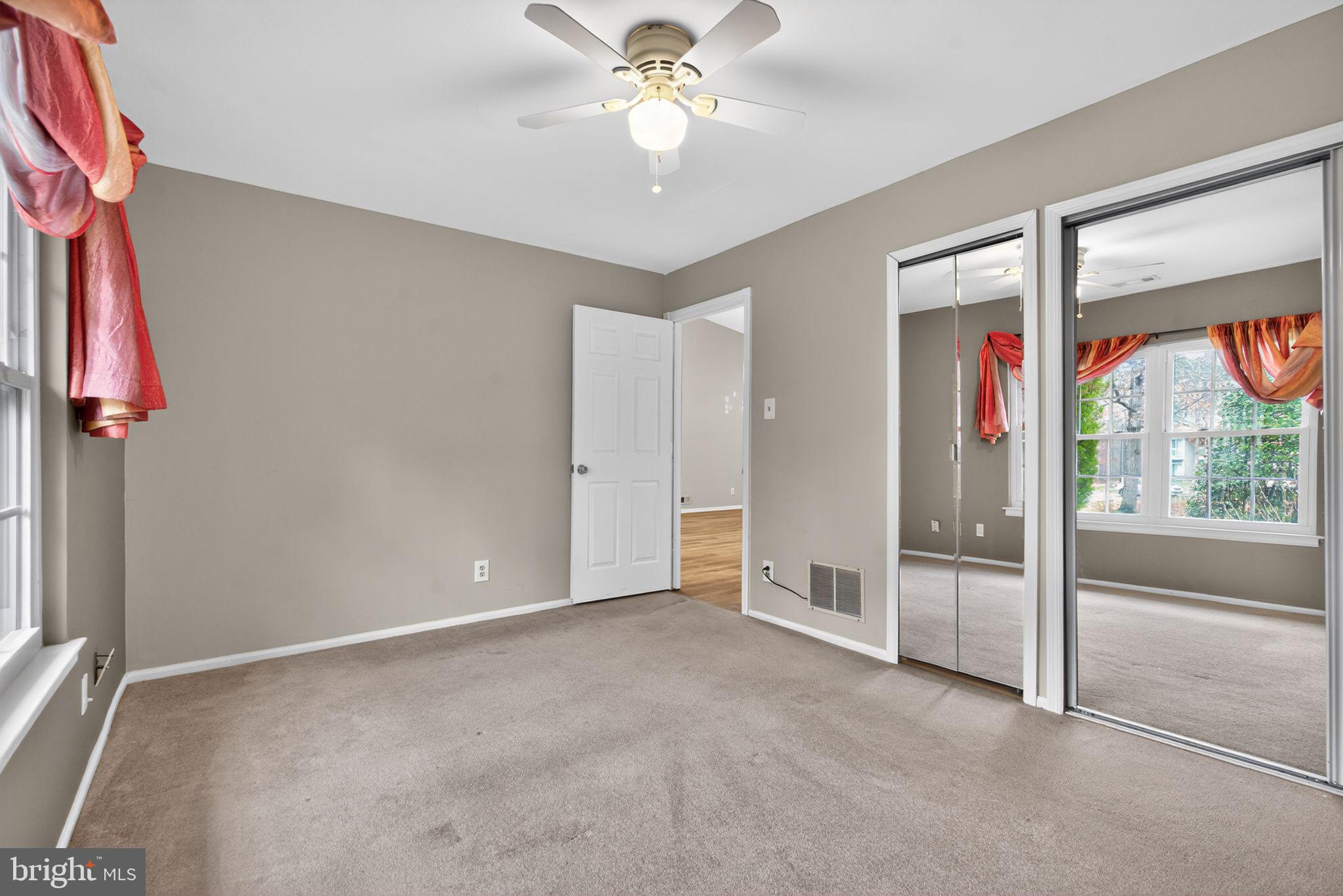 22 Club Place Absecon, NJ 08205 - Photo 16 of 37 wooden floor in an empty room with a window