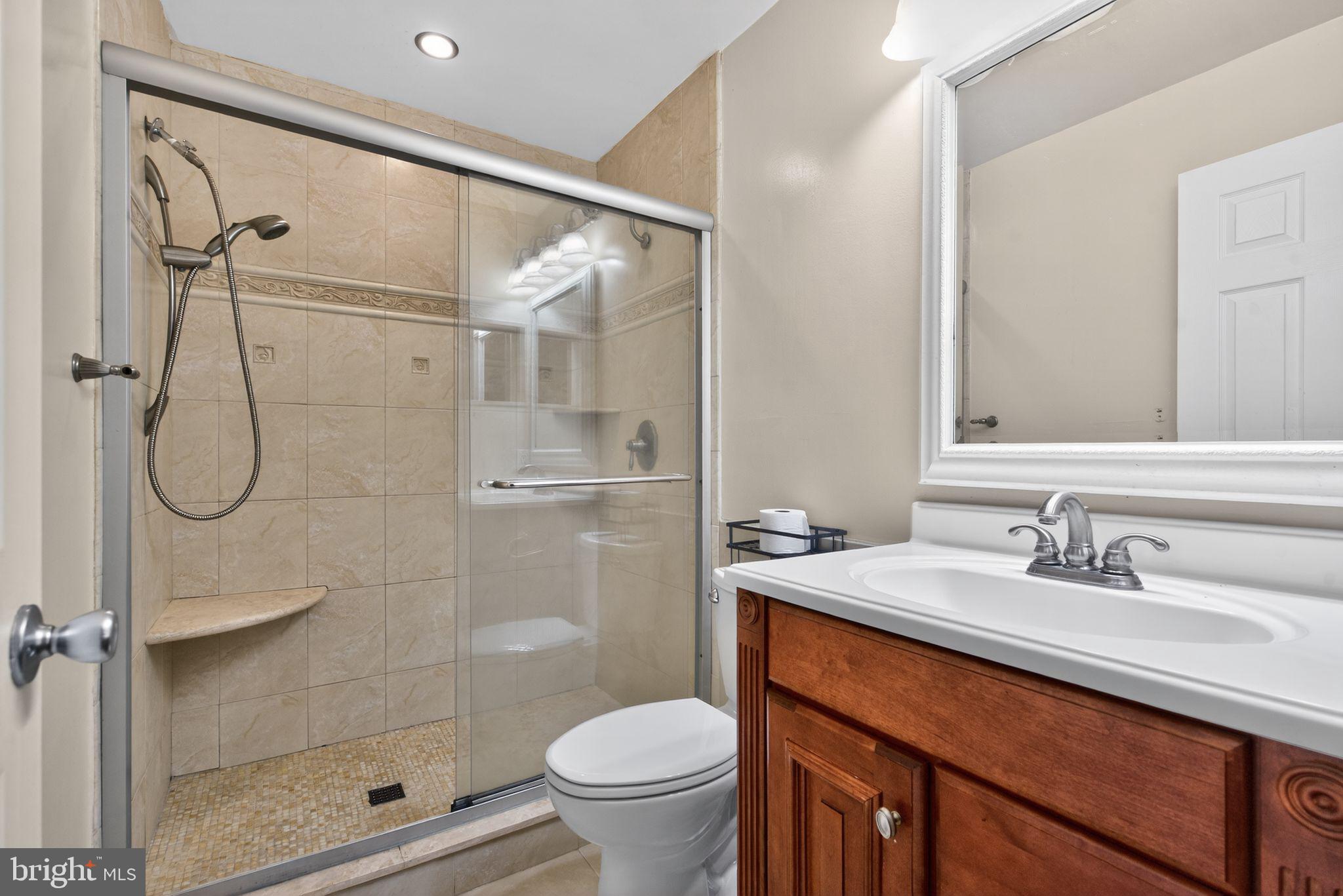 22 Club Place Absecon, NJ 08205 - Photo 18 of 37 a bathroom with a sink toilet and shower