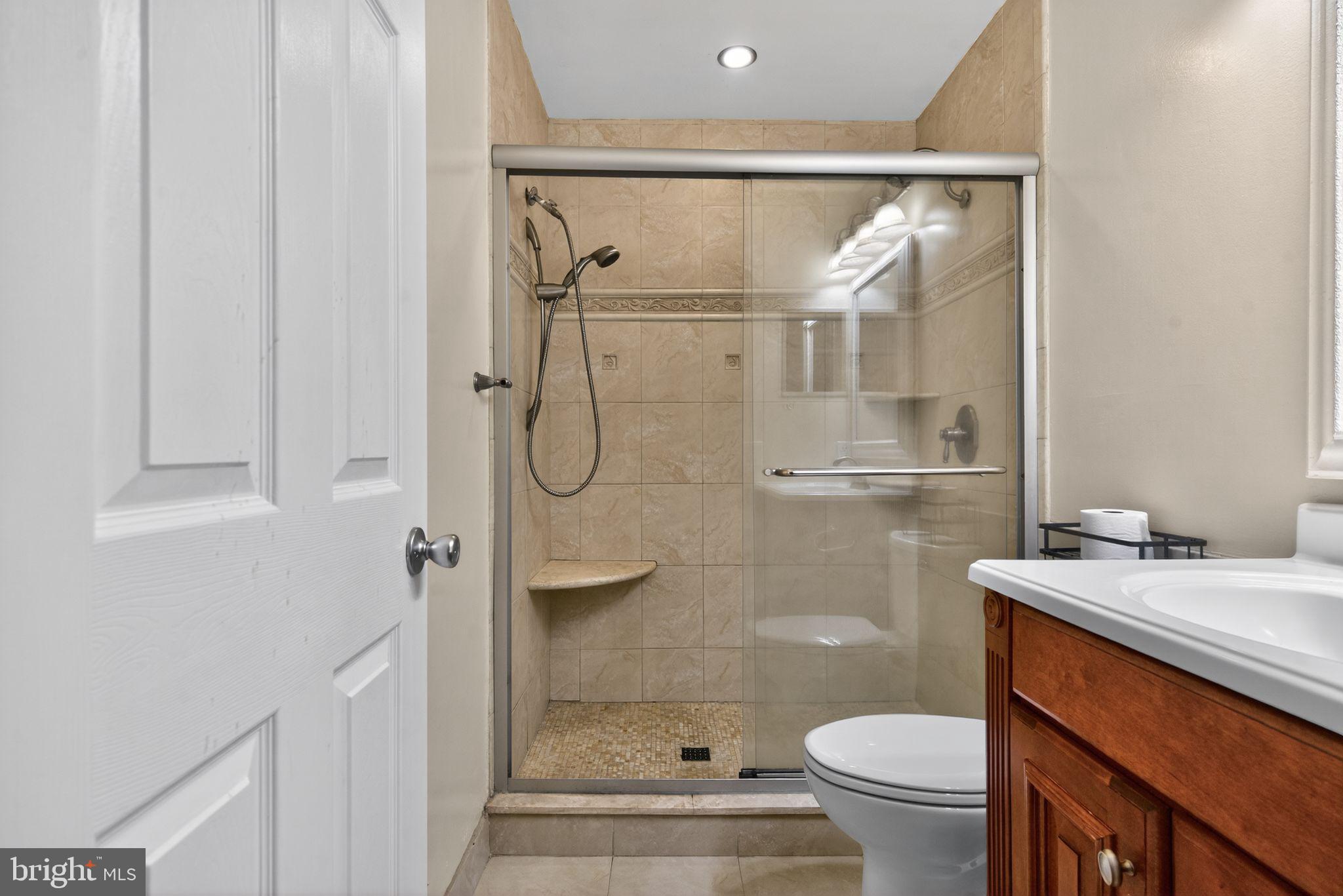 22 Club Place Absecon, NJ 08205 - Photo 20 of 37 a bathroom with a shower toilet and sink