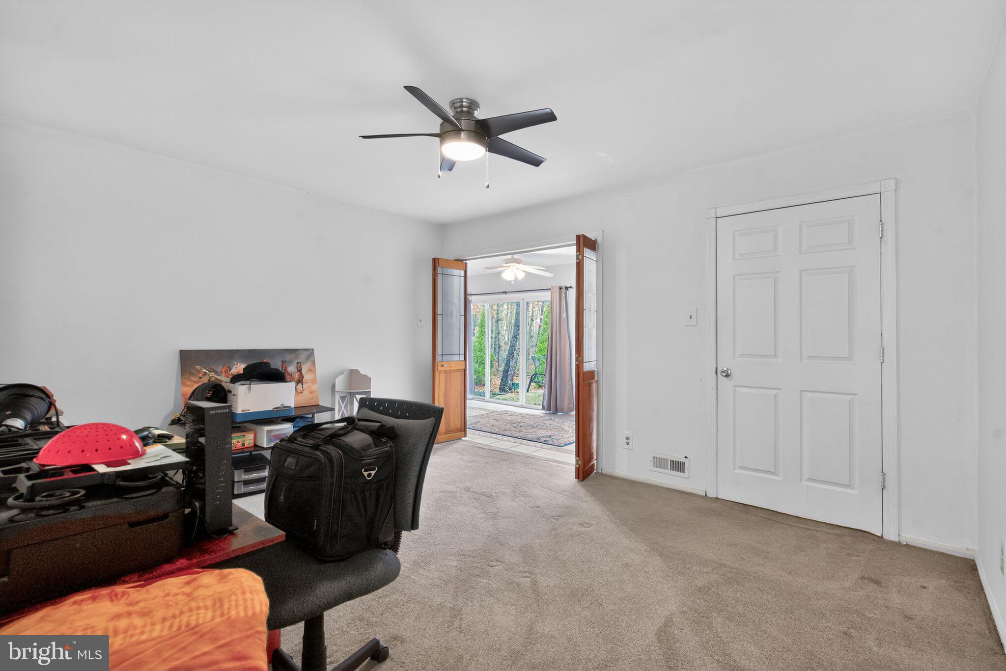 22 Club Place Absecon, NJ 08205 - Photo 22 of 37 a view of a livingroom with workspace and a window
