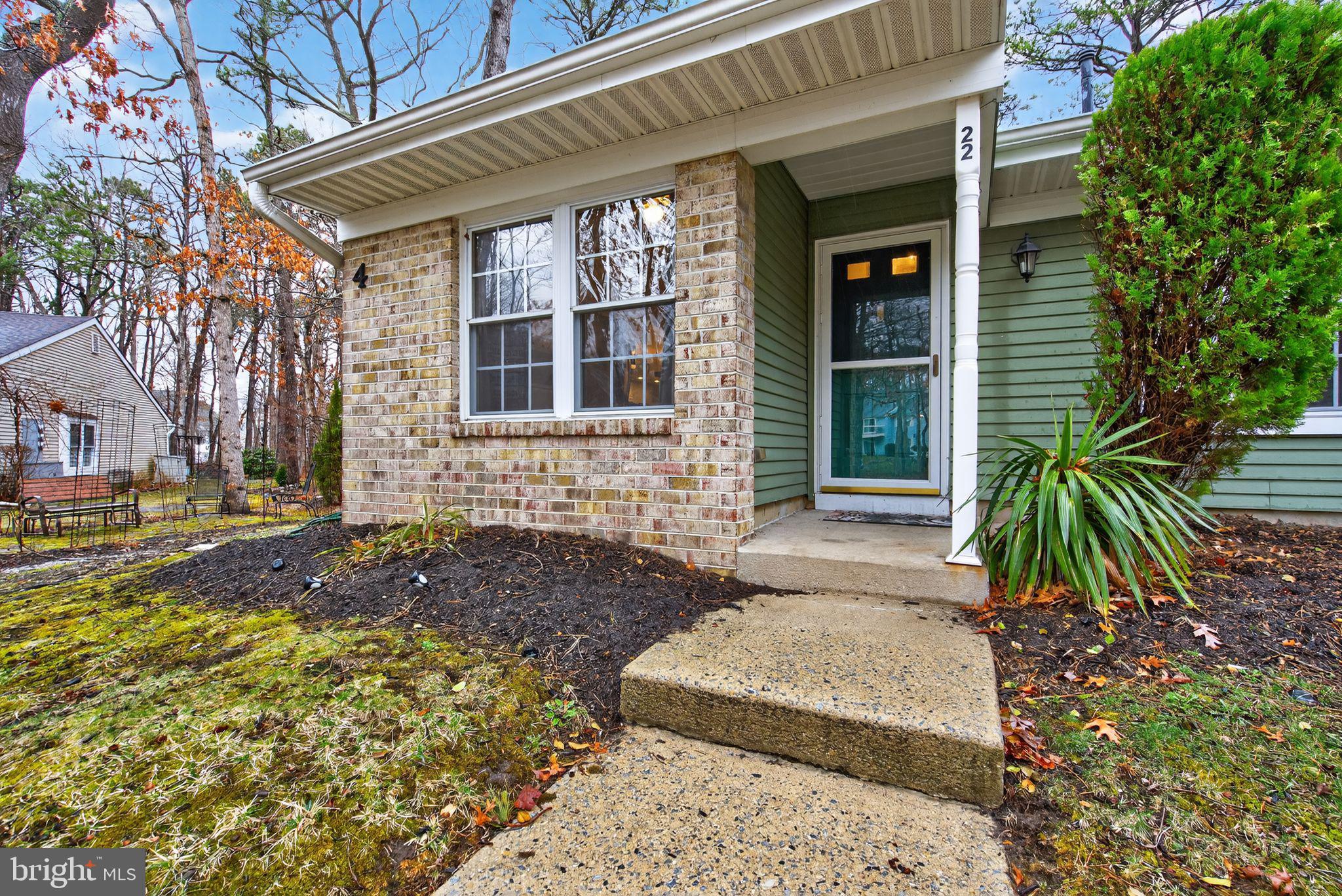 22 Club Place Absecon, NJ 08205 - Photo 30 of 37 a front view of a house with a yard