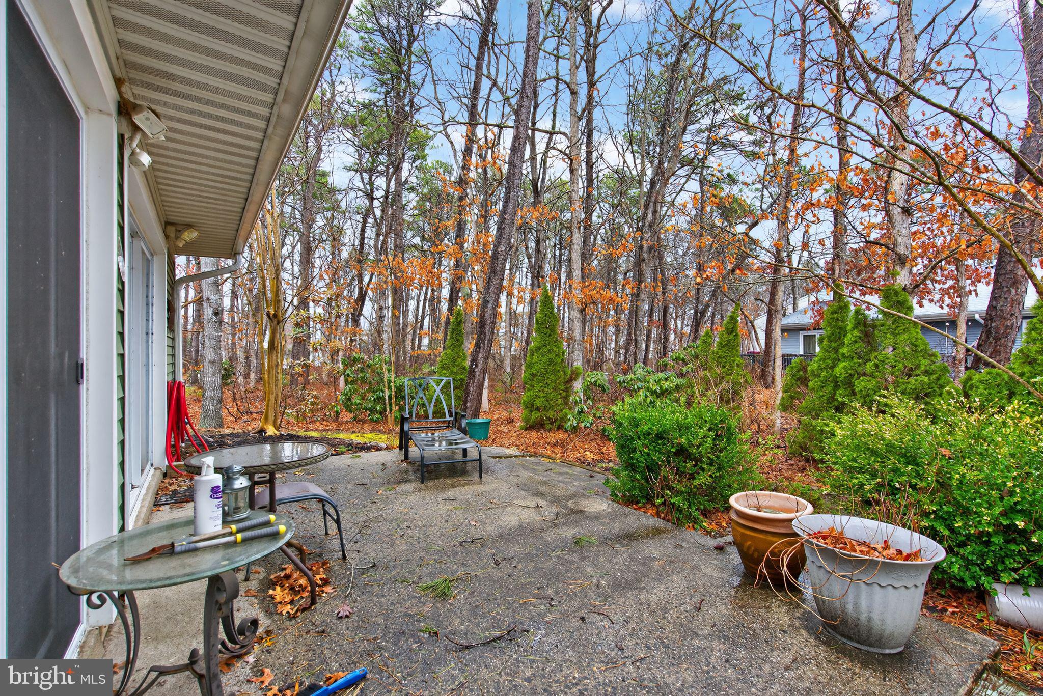 22 Club Place Absecon, NJ 08205 - Photo 31 of 37 a view of a patio with chairs and plants