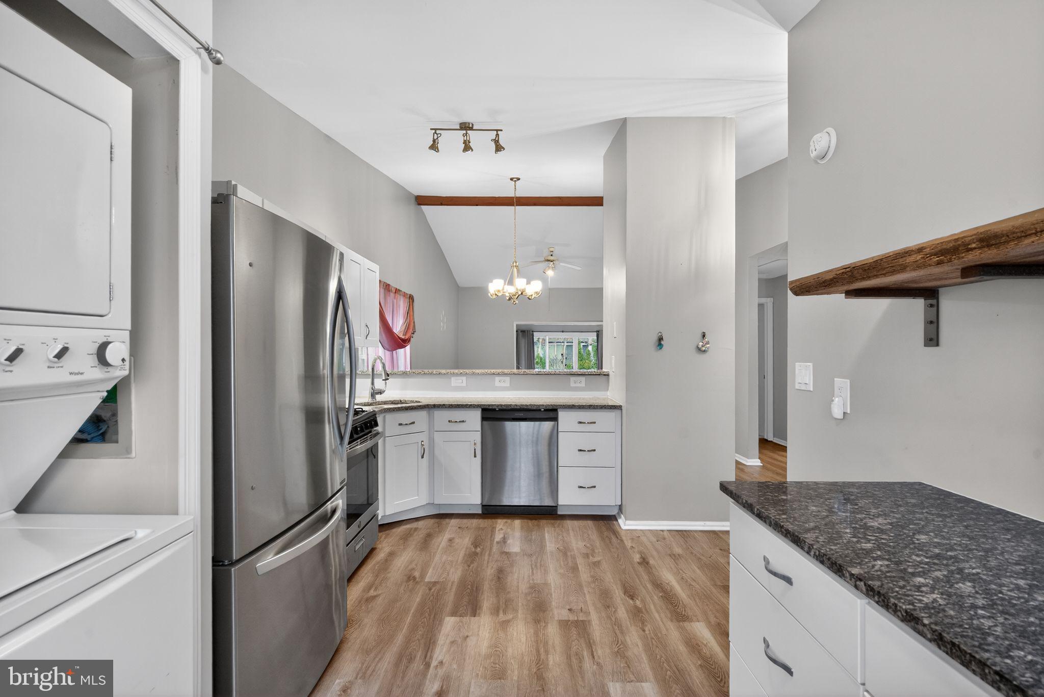 22 Club Place Absecon, NJ 08205 - Photo 7 of 37 a kitchen with stainless steel appliances granite countertop a refrigerator and a sink