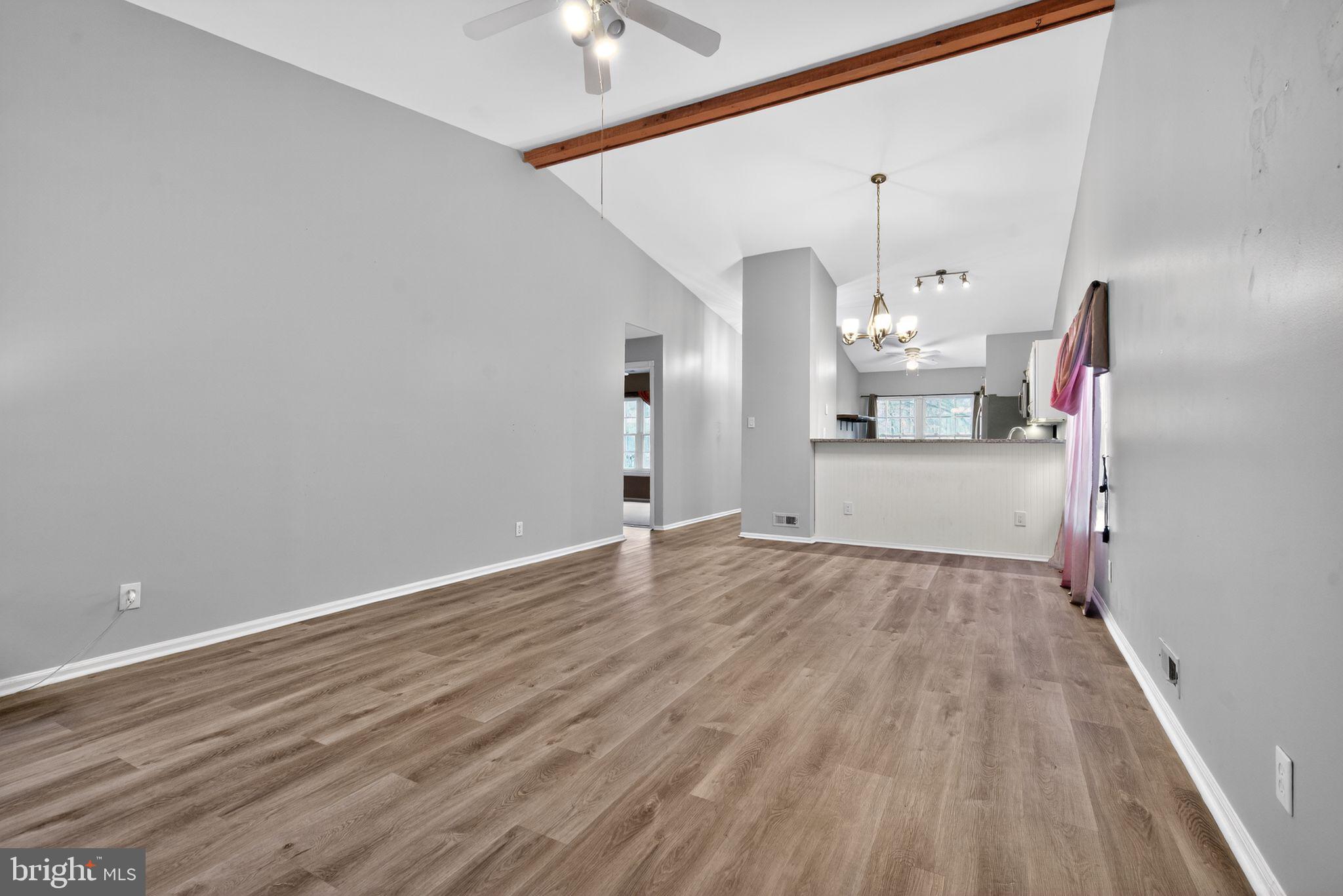 22 Club Place Absecon, NJ 08205 - Photo 10 of 37 a view of empty room with wooden floor