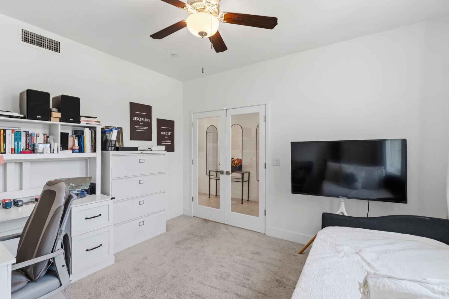 6326 West Richert Avenue Fresno, CA 93723 - Photo 19 of 45 a view of a livingroom with furniture and a flat screen tv