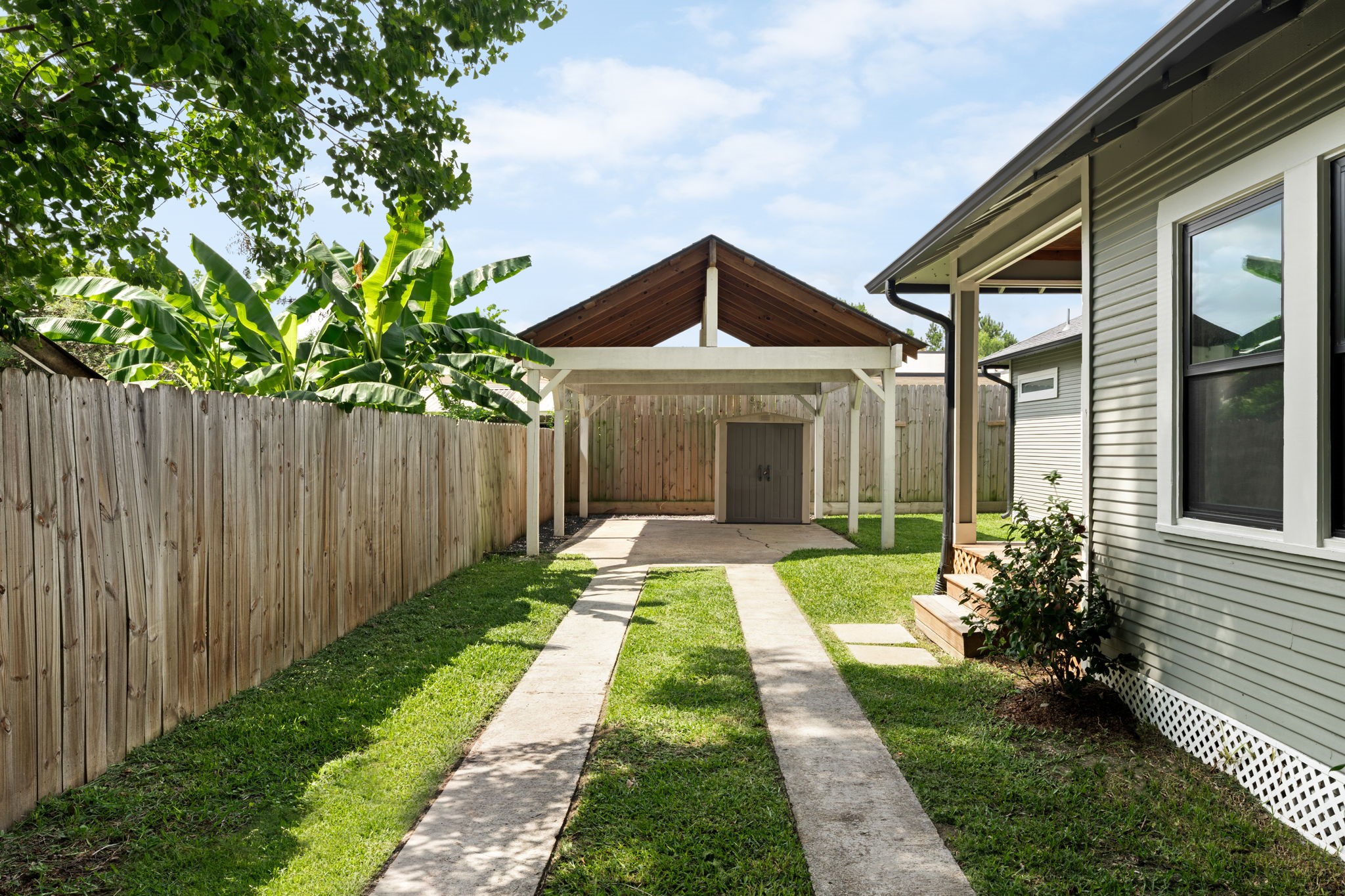 1022 Key Street Houston, TX 77009 - Photo 28 of 30 The detached carport provides essential protection for your vehicles while keeping the backyard open and airy.