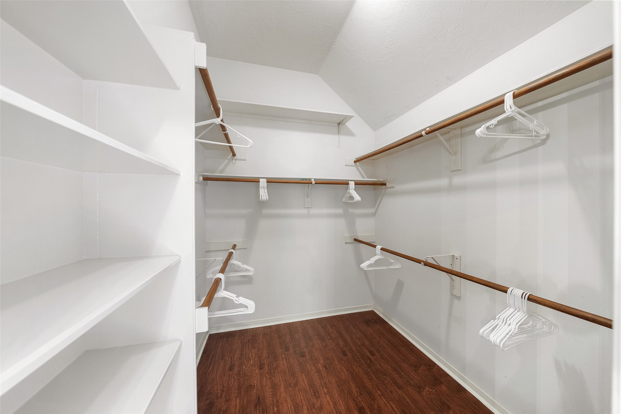 19718 Teller Boulevard Spring, TX 77388 - Photo 24 of 47 a view of walk in closet with empty racks