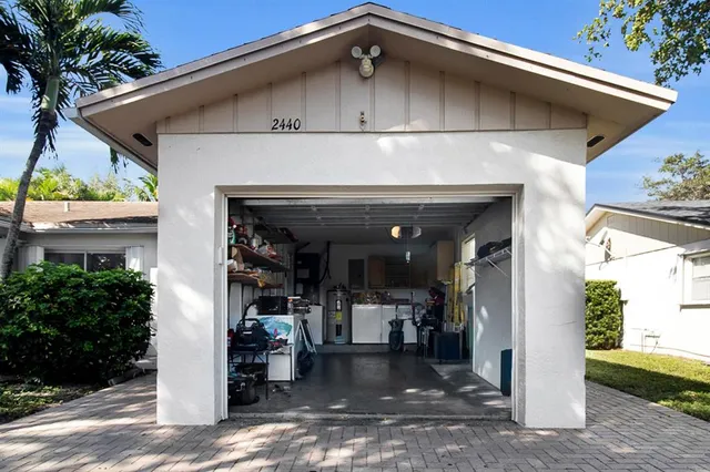 a view of a wooden house with a small yard