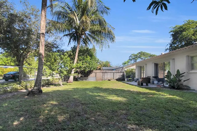 a view of a backyard with a patio