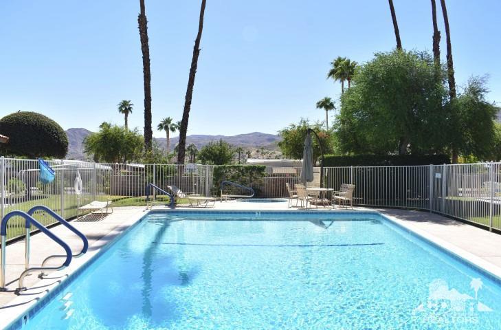 6243 East Driver Road Palm Springs, CA 92264 - Photo 2 of 14 a view of a swimming pool with a lounge chairs